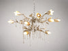Decorative chandelier with floral design on a gray background