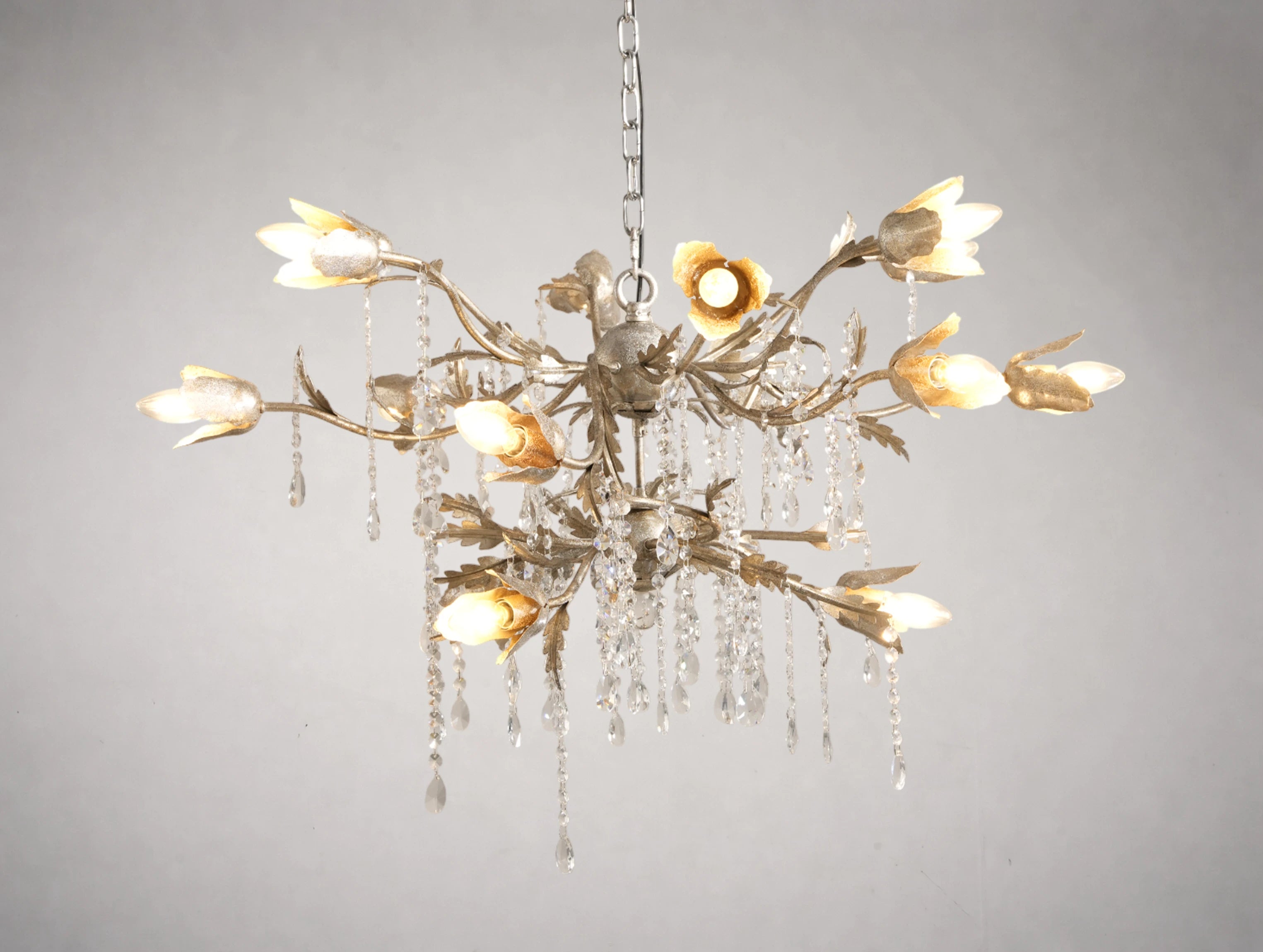 Decorative chandelier with floral design on a gray background
